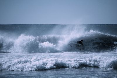 Waves splashing on rocks