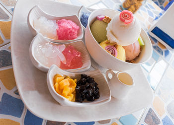 High angle view of fruits in plate on table