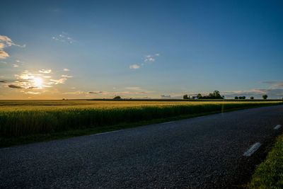 Road passing through field