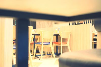 Empty chairs and tables in restaurant