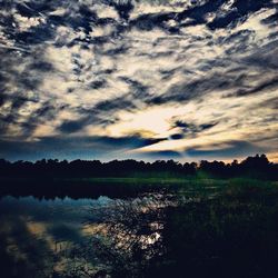 Scenic view of landscape against cloudy sky