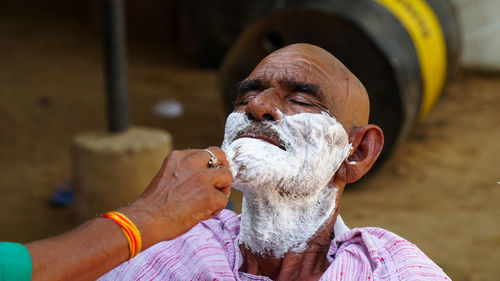 Portrait of man holding ice cream