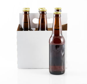 Close-up of beer bottle against white background