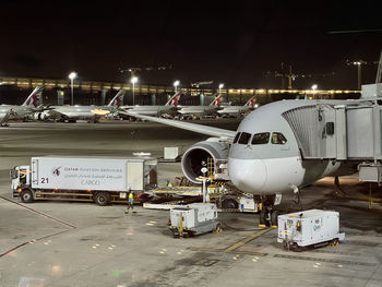 Airplane on airport runway at night