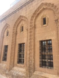 Low angle view of old building against sky