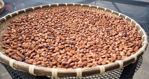 High angle view of roasted coffee beans in basket