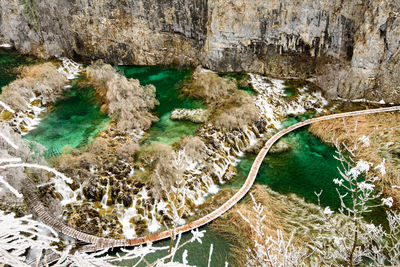 High angle view of rocks by sea