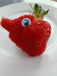 Close-up of strawberry in plate on table