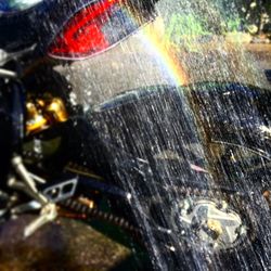 Close-up of raindrops on car windshield during rainy season