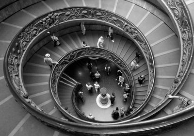 High angle view of people walking on spiral staircase in vatican museum