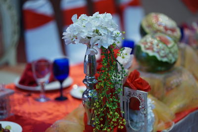 Close-up of roses in vase on table