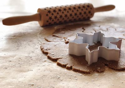 Close-up of pastry cutter on dough