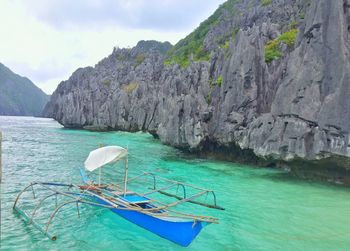 Boats moored in sea