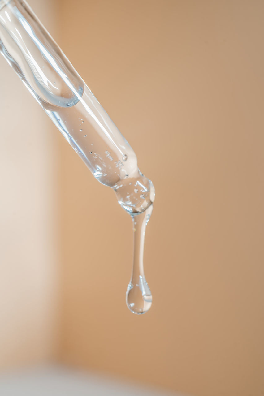 CLOSE-UP OF WATER DROP ON GLASS