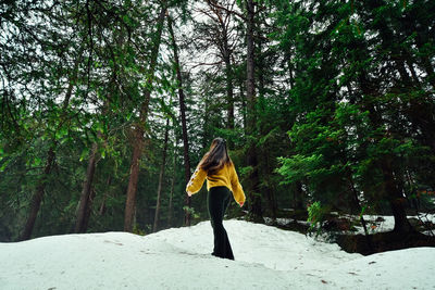 Man standing on snow covered land