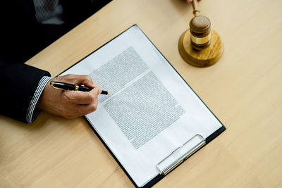 High angle view of man using laptop on table