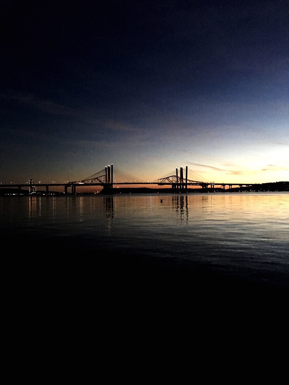 VIEW OF BRIDGE OVER SEA AGAINST SKY