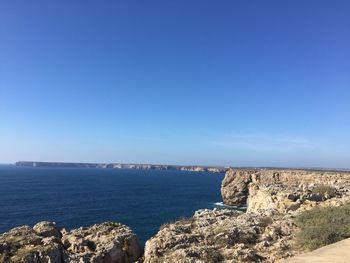 Scenic view of sea against clear blue sky