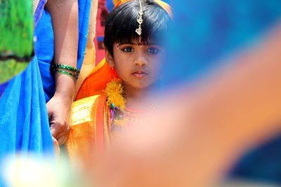 Close-up of girl against blue background