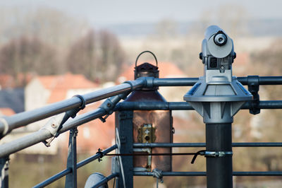 Close-up of coin operated binoculars against blurred background