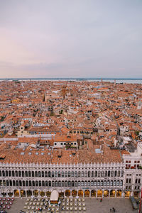 High angle view of city buildings against sky