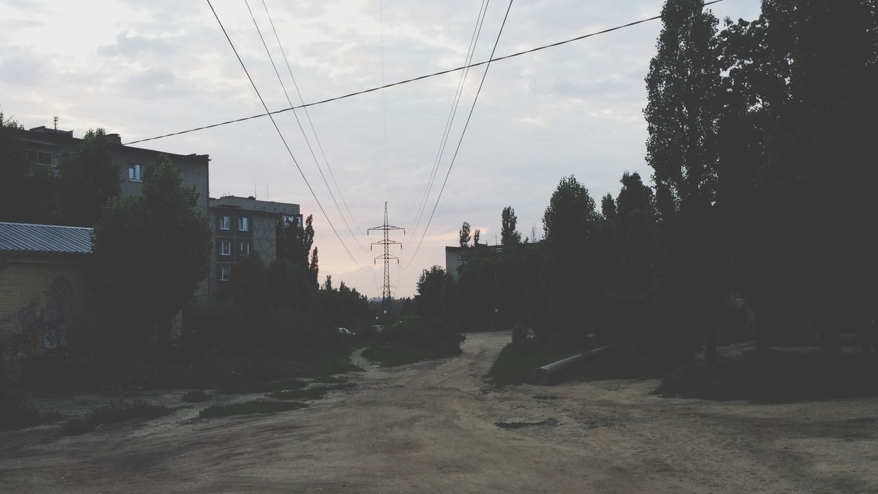 sky, architecture, built structure, building exterior, power line, electricity pylon, cloud - sky, cloud, cable, house, tree, electricity, low angle view, power supply, outdoors, connection, no people, cloudy, residential structure, day