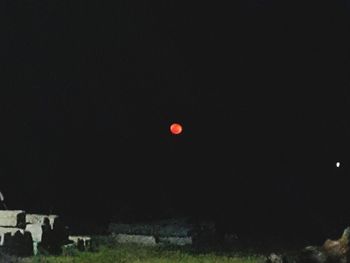 Scenic view of moon against clear sky at night