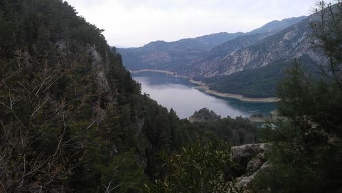 Scenic view of lake with mountains in background