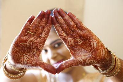 Close-up of woman hands in henna tatoos