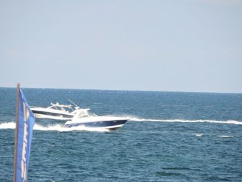 Scenic view of sea against blue sky