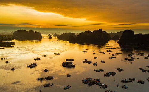 Scenic view of sea against orange sky