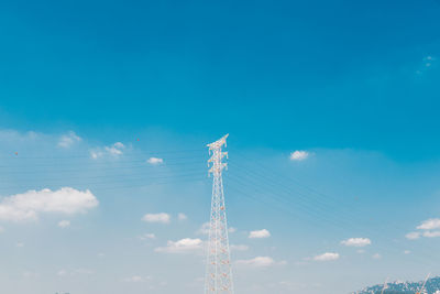 Low angle view of electricity pylon against sky