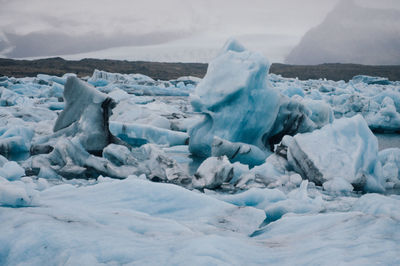 Close-up of ice formations against sky