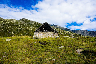 Alp corte di mezzo in front of mountain range in the alps, ticino, switzerland