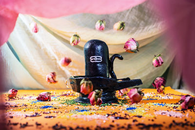 Close-up of small figurine on table