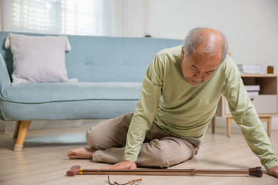 Rear view of man working at home