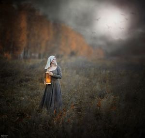 Woman standing on field