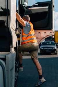 Side view of woman exercising in car