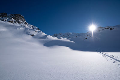 Scenic view of snowcapped mountains against sky