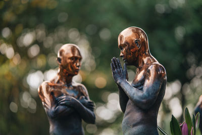 Close-up of female sculpture against blurred background