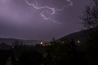 Low angle view of lightning in sky at night