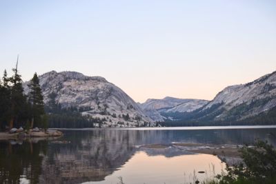 Scenic view of lake and mountains against clear sky