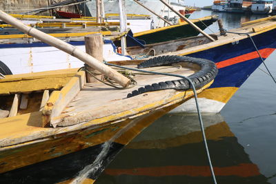 Close-up of fishing boat moored at harbor