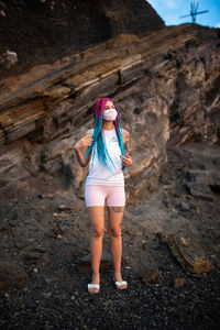 Woman standing on rock