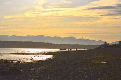 Scenic view of sea against sky at sunset