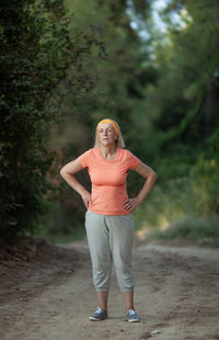 Portrait of woman standing on land