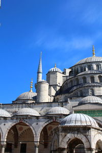 Low angle view of building against blue sky