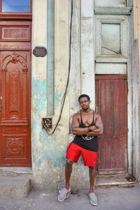 Full length portrait of man standing on street