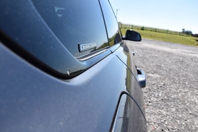 Close-up of car on road