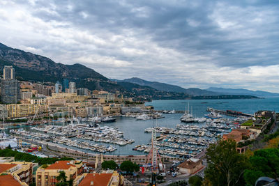 High angle view of harbor and buildings in city